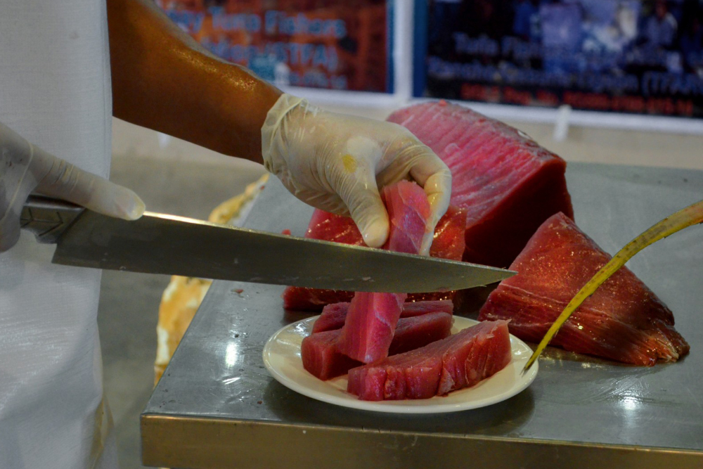 a chef prepares grade-a sashimi at a restaurant in batangas
