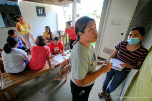 wwf philippines staff look over the by laws agreed upon by a gslc in paluan mindoro